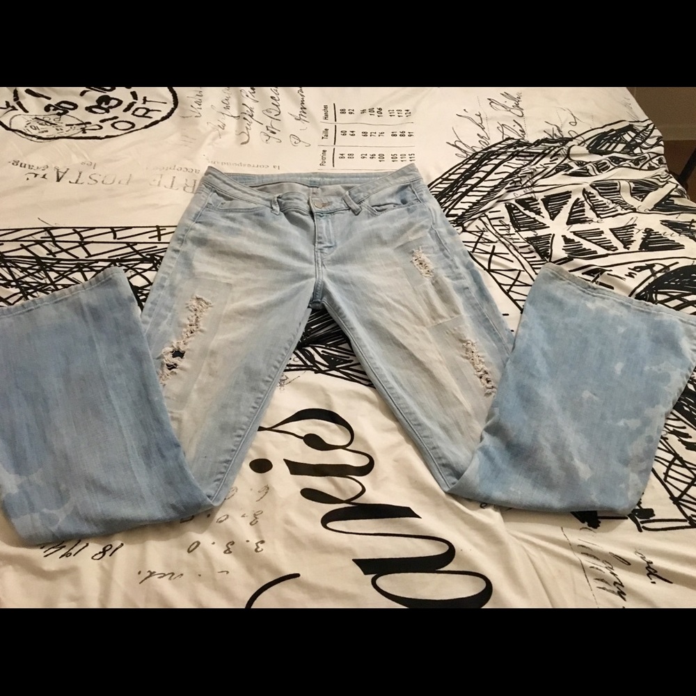 Calvin Klein distressed faded flare legged jeans.